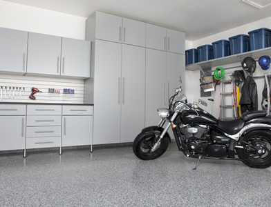 garage cabinets and a parked motorcycle